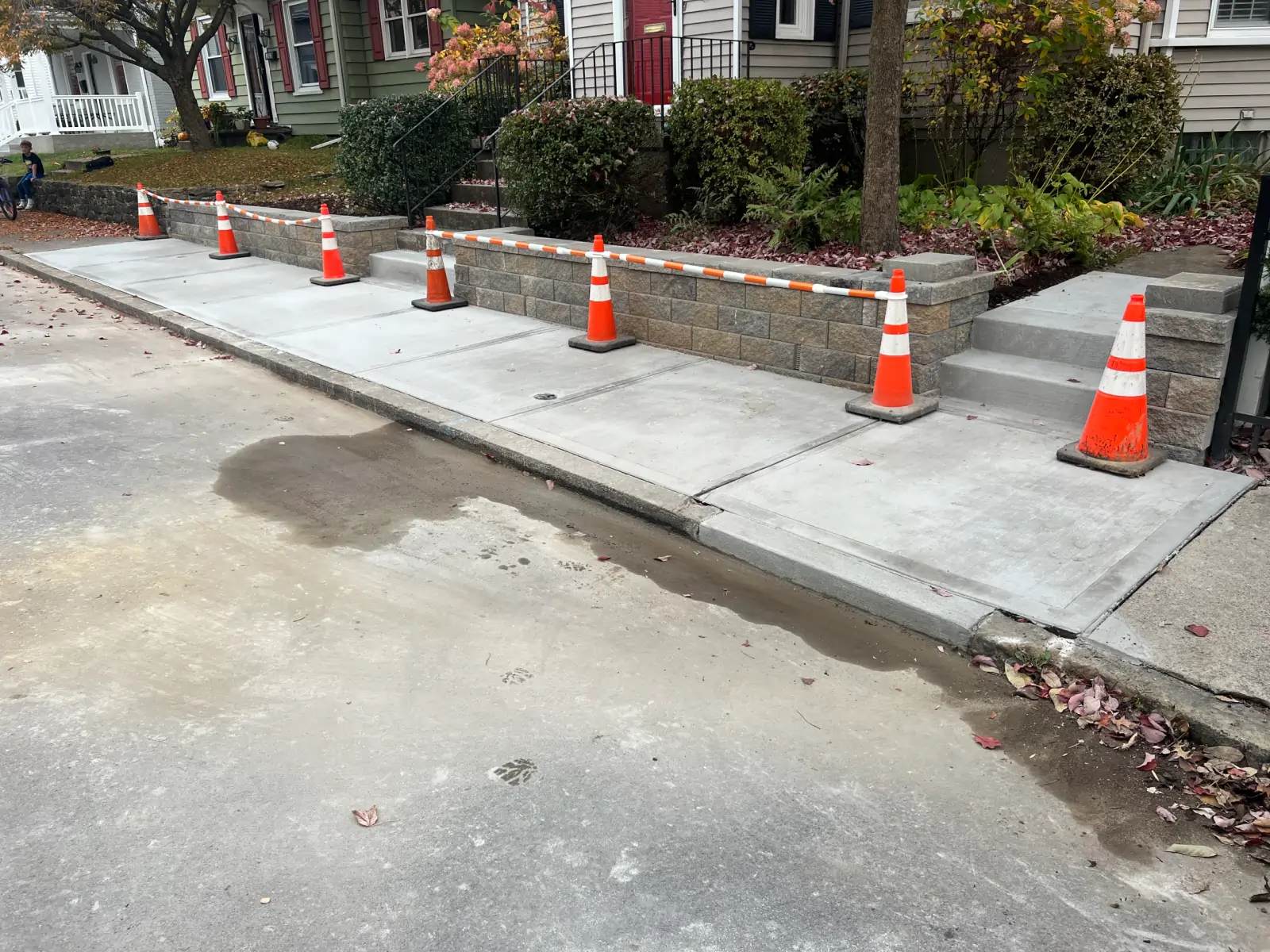 logan-st-sidewalk-wall-1-scaled-e1760552546409-1